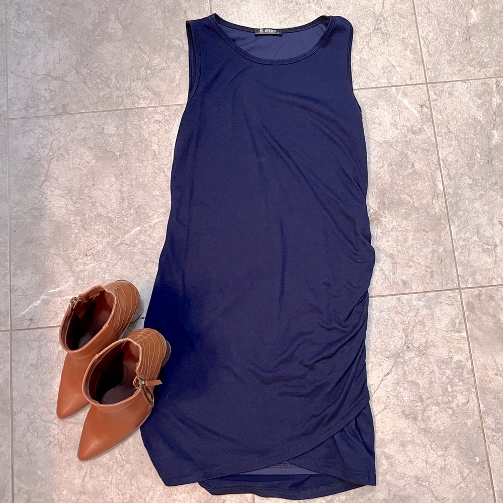 Sleeveless Navy Dress with cute side detailing.